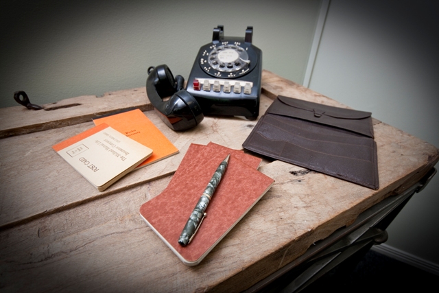 Vintage billfold, notepads, rotary dial phone and mechanical pencil